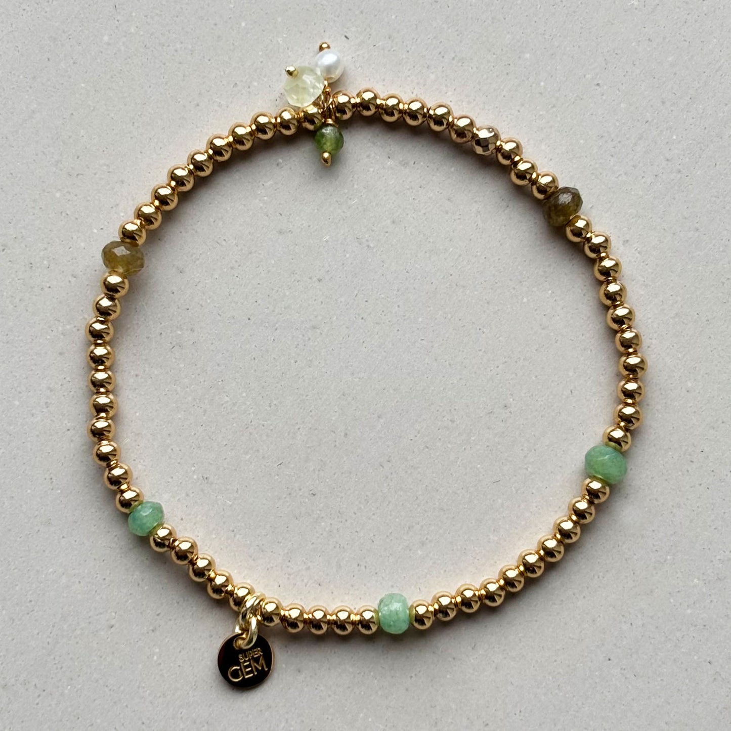 GOLDEN DOTS GREEN CHARMS